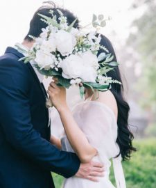 Image of young Asian bride and groom